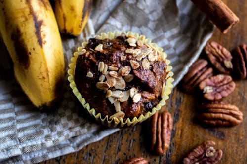 A close-up of freshly baked banana nut muffins on a cooling rack, ready to be enjoyed